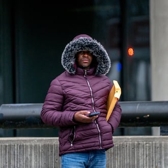 An Atlanta commuter bundles up amid extreme cold earlier this year. Freezing temperatures are expected to make a comeback Monday and Tuesday. (Ben Hendren for the AJC file)