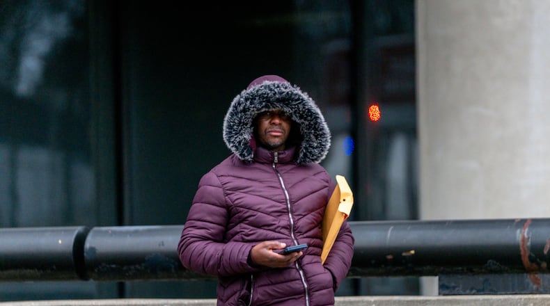 An Atlanta commuter bundles up amid extreme cold earlier this year. Freezing temperatures are expected to make a comeback Monday and Tuesday. (Ben Hendren for the AJC file)