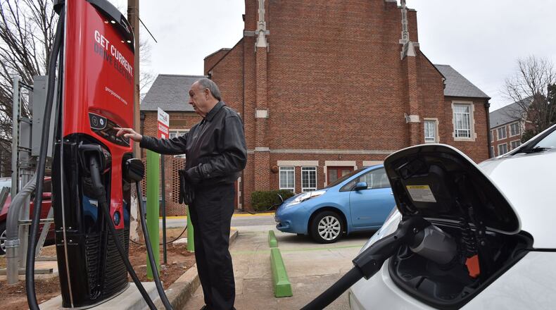 Don Francis, executive director of Clean Cities Georgia, charges his electric vehicle using DC Fast Charging station at Agnes Scott College, in this file photo from January 2016. Francis is hoping lawmakers will take another look at incentives for electric cars, perhaps with a break on sales tax. HYOSUB SHIN / HSHIN@AJC.COM