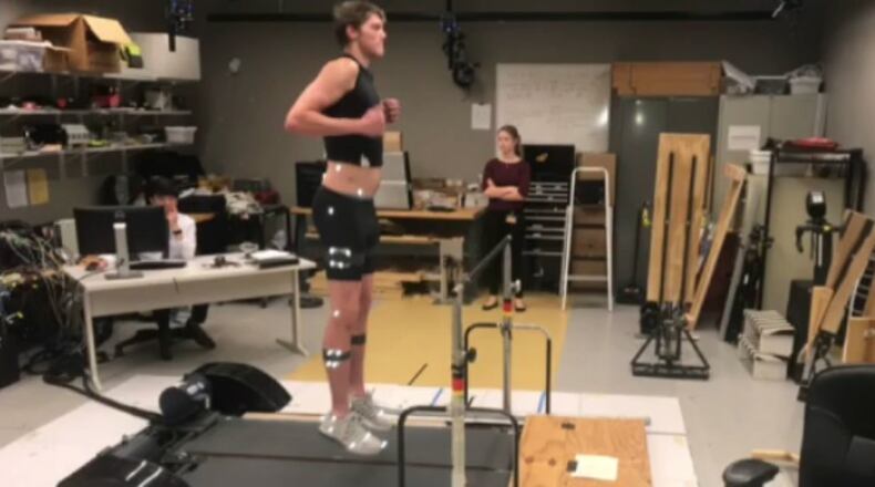 Georgia Tech center Ben Lammers jumps on a treadmill equipped with a force plate last fall at the school's Comparative Neuromechanics Laboratory.