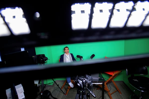 Hour Hum, a Cambodian reporter at Radio Free Asia who spent 7 years in a Thai refugee camp before arriving in the United States, poses for a portrait in the podcast room, Tuesday, April 1, 2025, at the RFA office in Washington. (AP Photo/Rod Lamkey, Jr.)