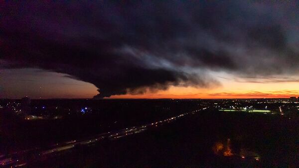 A plume of smoke wafts over airport property after reports of a plane crash at Louisville International Airport, Tuesday, Nov. 4, 2025, in Louisville, Ky. (Courtesy of Jonathan Palmer)