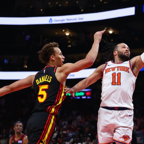 New York Knicks guard Jalen Brunson (11) shoots against Atlanta Hawks guard Dyson Daniels (5) during the second half of an NBA basketball game, Monday, April 6, 2026, in Atlanta. (AP Photo/Colin Hubbard)