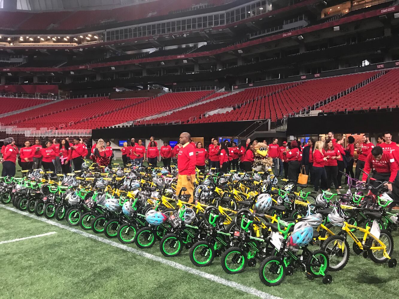 Delta volunteers assemble 100 bicycles to donate to kids