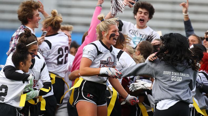 Hillgrove players and fans rush the field to celebrate a 20-6 victory over Marietta in their GHSA Flag Football Championship Division 3 game on Thursday, Dec 9, 2021, in Atlanta.   “Curtis Compton / Curtis.Compton@ajc.com”`