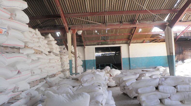 Tons of flour sit in a warehouse in Port-au-Prince with little way to get it to aid workers and starving people.
