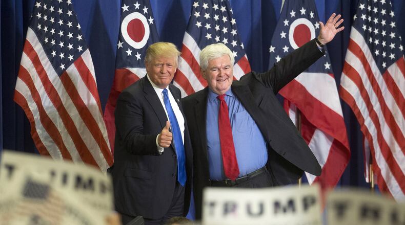 Republican presidential candidate Donald Trump, left, and former House Speaker Newt Gingrich, right, acknowledge the crowd during a campaign rally at the Sharonville Convention Center, Wednesday, July 6, 2016, in Cincinnati. (AP Photo/John Minchillo)