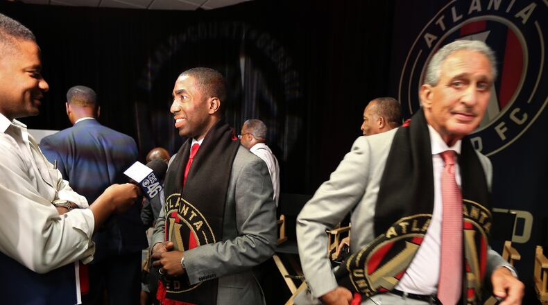 August 4, 2015 Decatur: DeKalb County Interim CEO Lee May, left, answers a reporters questions as Arthur Blank slips past following a Tuesday afternoon August 4, 2015 announcement that Atlanta United FC would locate their headquarters and practice facility in DeKalb Couny. Ben Gray / bgray@ajc.com