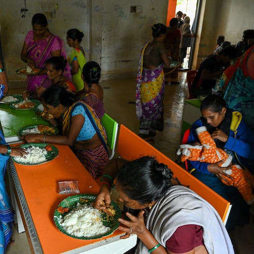 Evacuated Indian villagers of Uppada eat food in a temporary relief centre as Cyclone Montha, in Kakinada district of Andhra Pradesh, India, Tuesday, Oct. 28, 2025. (AP Photo)