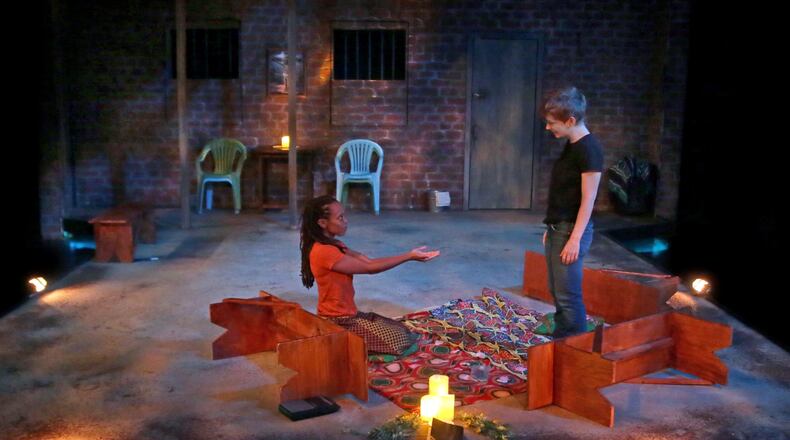 Isake Akanke and Ashley Anderson star as Adiel and Chris in “Cardboard Piano” at Actor’s Express. CONTRIBUTED BY STUDIO 7 PHOTOGRAPHY