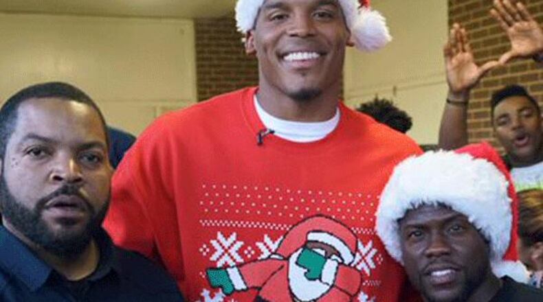 Cam Newton is on top of the world but his Christmas sweater..
