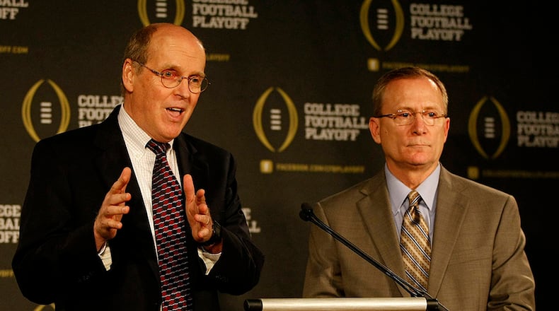 College Football Playoff executive director Bill Hancock (left) and committee chairman Jeff Long answer questions after announcing members of the selection committee in Irving, Texas, on Wednesday, Oct. 16, 2013.
