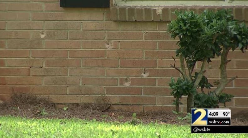 The exterior of the Cobb County house has several bullet holes. (Credit: Channel 2 Action News)