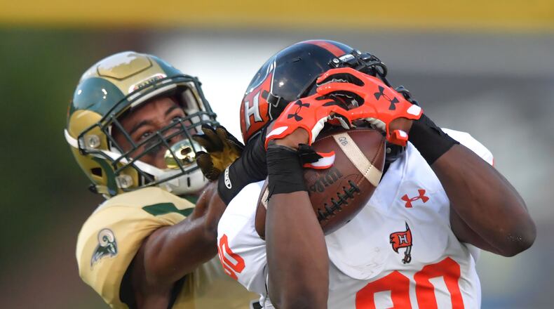 Hoover's Shedrick Jackson (80) makes a catch against Grayson's Kenyatta Watson (2) in the first half of Grayson vs Hoover (Alabama) at Grayson High School in Loganville on Friday, August 25, 2017. HYOSUB SHIN / HSHIN@AJC.COM