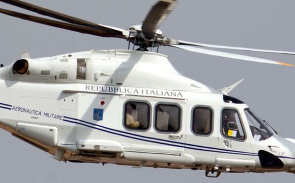 FILE - The helicopter carrying Pope Francis, sitting by the window at left, flies on its way to Castel Gandolfo, south of Rome, on March 23, 2013, to meet with Emeritus Pope Benedict XVI, where he has been living since resigning on Feb. 28, 2013. (AP Photo/Andrew Medichini, file)