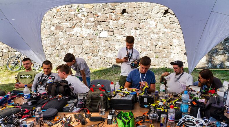 Competitors repair their drones in the repair area during the Eastern European Cup 2017 on September 2, 2017 in Uzhgorod, Ukraine. A Naperville, Ill. startup hub is looking to include an indoor drone racing track for quadcopter pilots to race. (Yanosh Nemesh/Dreamstime/TNS)