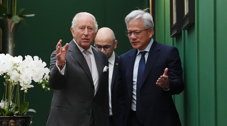 Britain's King Charles III, left, walks with Nvidia chief executive Jensen Huang, right, and Sir Demis Hassabis to a meeting for leaders from the artificial intelligence (AI) sector, government, and thought leaders to discuss how AI can be developed and deployed in ways that benefit society, at Dumfries House in Cumnock, Scotland, Thursday Sept. 17, 2026. (Jonathan Brady/PA via AP, Pool)