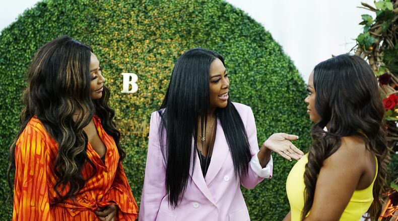 THE REAL HOUSEWIVES OF ATLANTA -- Pictured: (l-r) Cynthia Bailey, Kenya Moore, Kandi Burruss -- (Photo by: Annette Brown/Bravo)