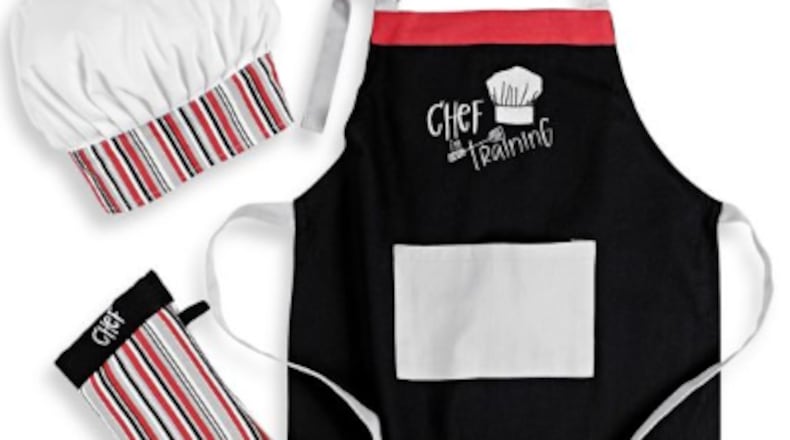 Gift your youngster cooking garb that fits like the Mukitchen Kids Chef in Training 3-Piece Apron Set available at Bed Bath & Beyond.