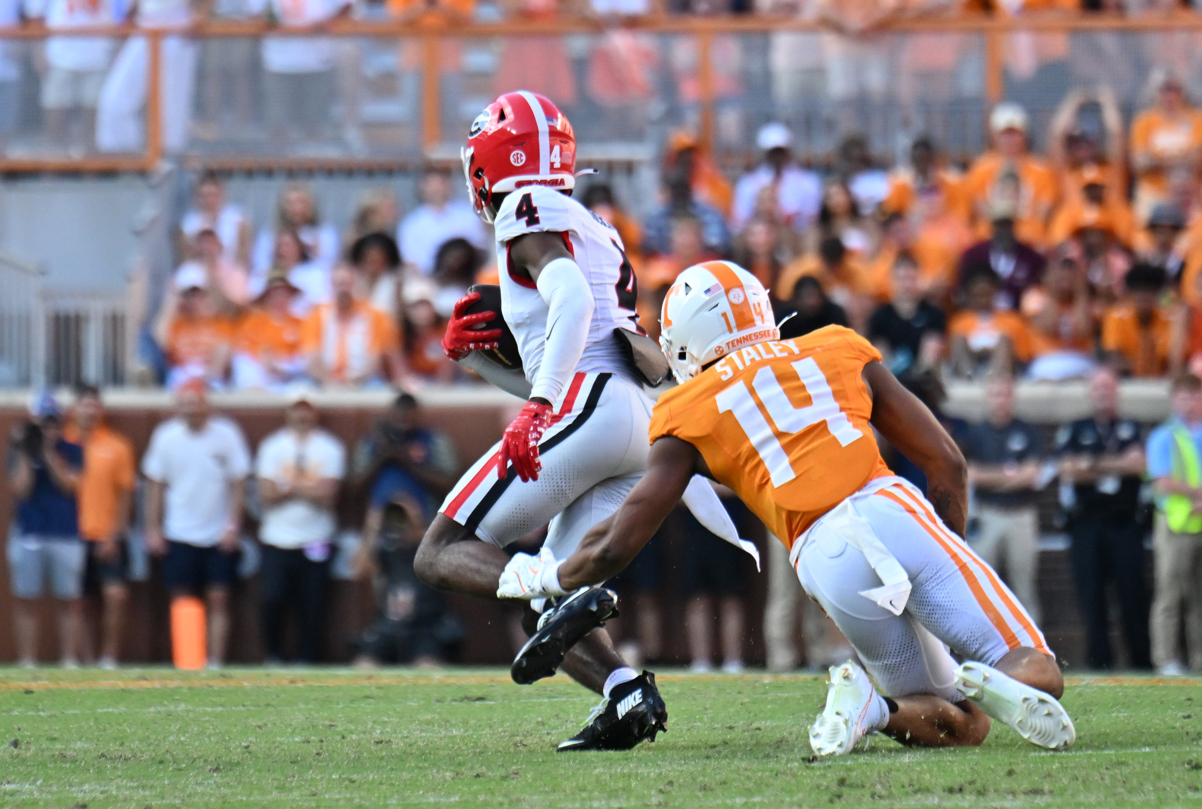 Georgia defensive back KJ Bolden runs after recovering a fumble against Tennessee during the second half at Neyland Stadium on Saturday, Sept. 13, 2025, in Knoxville, Tenn. (Hyosub Shin/AJC)