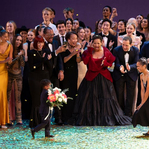 Dancer Misty Copeland, right, takes a bow during curtain calls with her son, Jackson, at her retirement performance from American Ballet Theatre at the David H. Koch Theater at Lincoln Center, Wednesday, Oct. 22, 2025, in New York. (Rosalie O'Connor via AP)