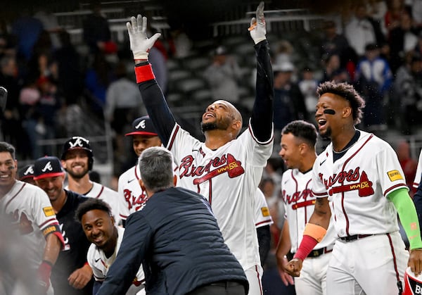 Atlanta Braves Dominic Smith celebrates with teammates after hitting a grand slam to win 6-2 over Kansas City Royals during the 9th inning of a baseball game at Truist Park, Saturday, March 28, 2026, in Atlanta. (Hyosub Shin/AJC)