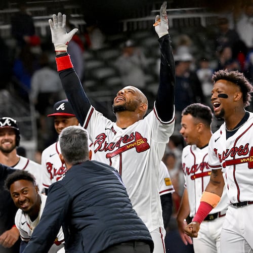 Atlanta Braves Dominic Smith celebrates with teammates after hitting a grand slam to win 6-2 over Kansas City Royals during the 9th inning of a baseball game at Truist Park, Saturday, March 28, 2026, in Atlanta. (Hyosub Shin/AJC)