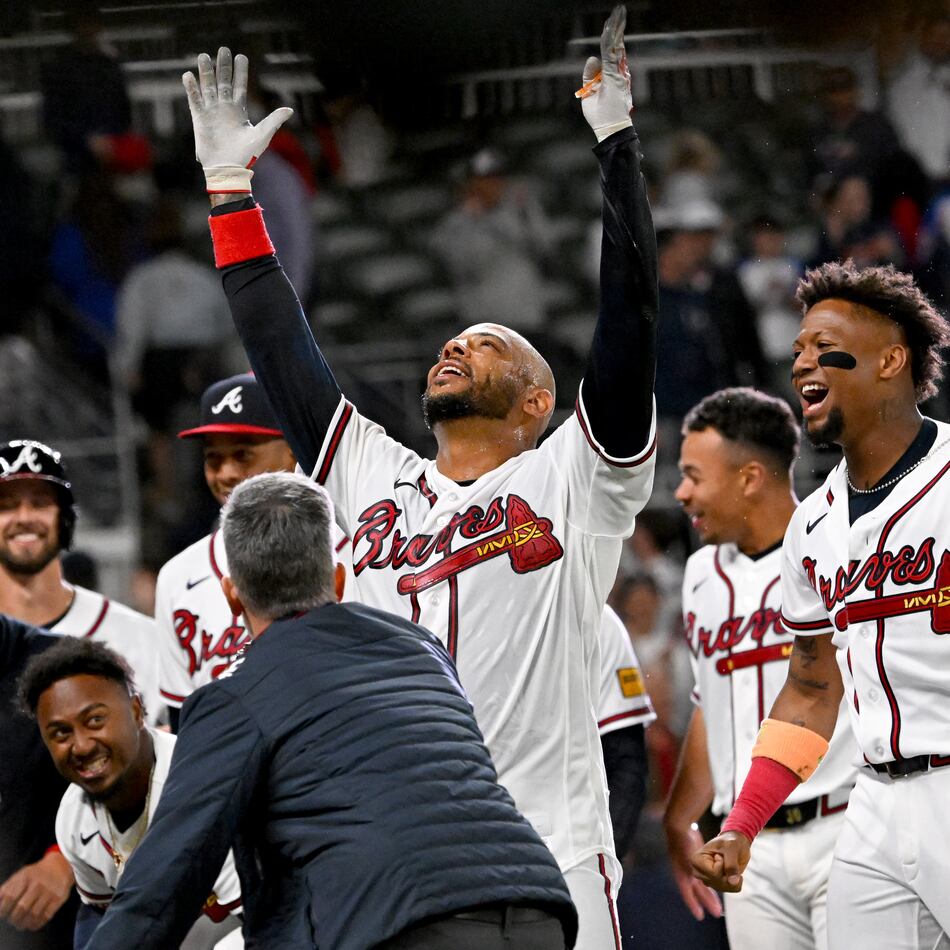 Atlanta Braves Dominic Smith celebrates with teammates after hitting a grand slam to win 6-2 over Kansas City Royals during the 9th inning of a baseball game at Truist Park, Saturday, March 28, 2026, in Atlanta. (Hyosub Shin/AJC)