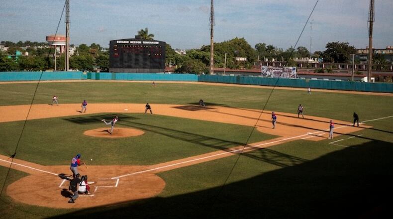 FILE -- A baseball game underway at Nelson Fernandez Stadium in San Jose, Cuba, Dec. 22, 2014. A goodwill tour of Cuba next week by Major League Baseball's commissioner Robert Manfred and several players will include at least three Cubans who had defected in recent years, a rare concession by the Cuban government that typically denounces them as traitors. (Josh Haner/The New York Times)