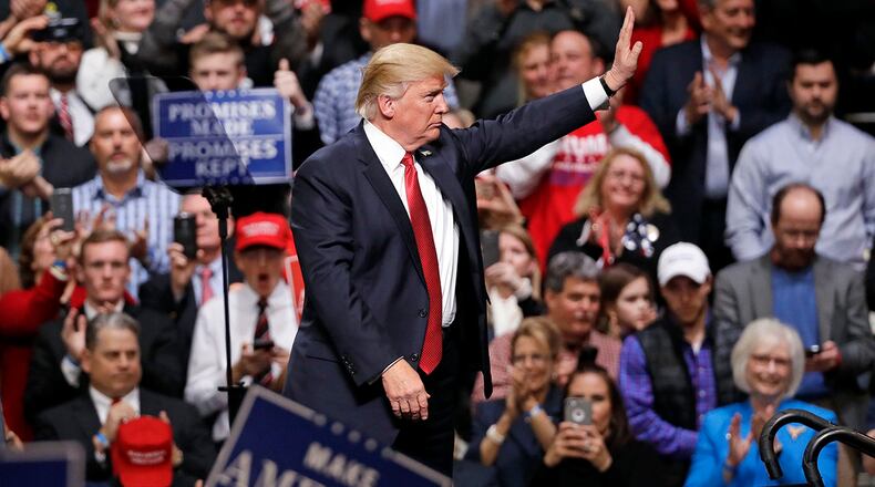 President Donald Trump waves to the crowd after speaking at a rally Wednesday, March 15, 2017, in Nashville, Tenn. (AP Photo/Mark Humphrey)