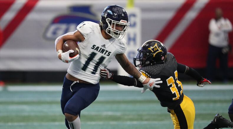 Cedar Grove wide receiver Jadon Haselwood (11) makes a move on Peach County defensive back Otiserion French on a kickoff return in the first half of the Class AAA State Championship at Mercedes-Benz Stadium, Tuesday, December 11, 2018, in Atlanta. The play was called back on a penalty by Cedar Grove. (Jason Getz/Special to the AJC)