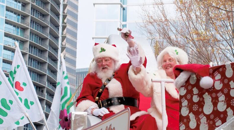 Santa and Mrs. Claus ride into Atlanta during the Children’s Christmas Parade. CONTRIBUTED BY CHILDREN’S HEALTHCARE