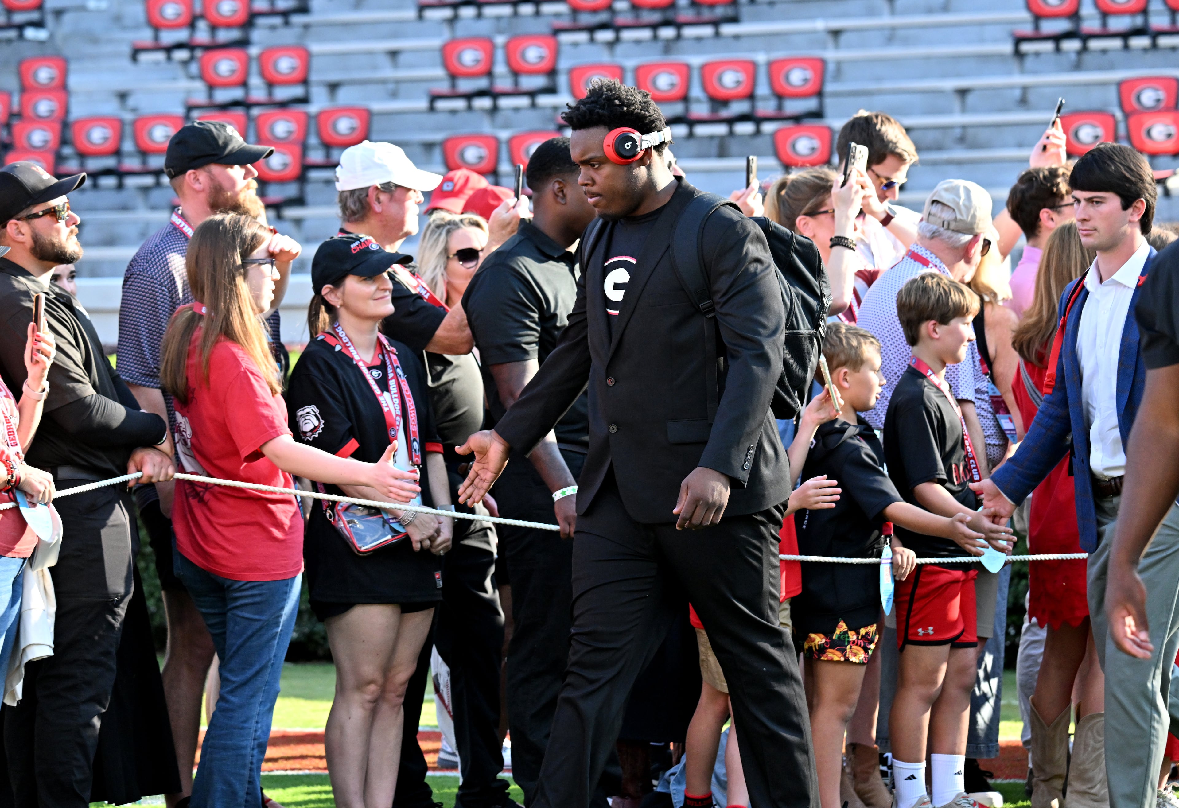 Georgia players and coaching staff arrive during the Dawg Walk to play Alabama in a NCAA college football game at Sanford Stadium, Saturday, September 27, 2025, in Athens. (Hyosub Shin / AJC)