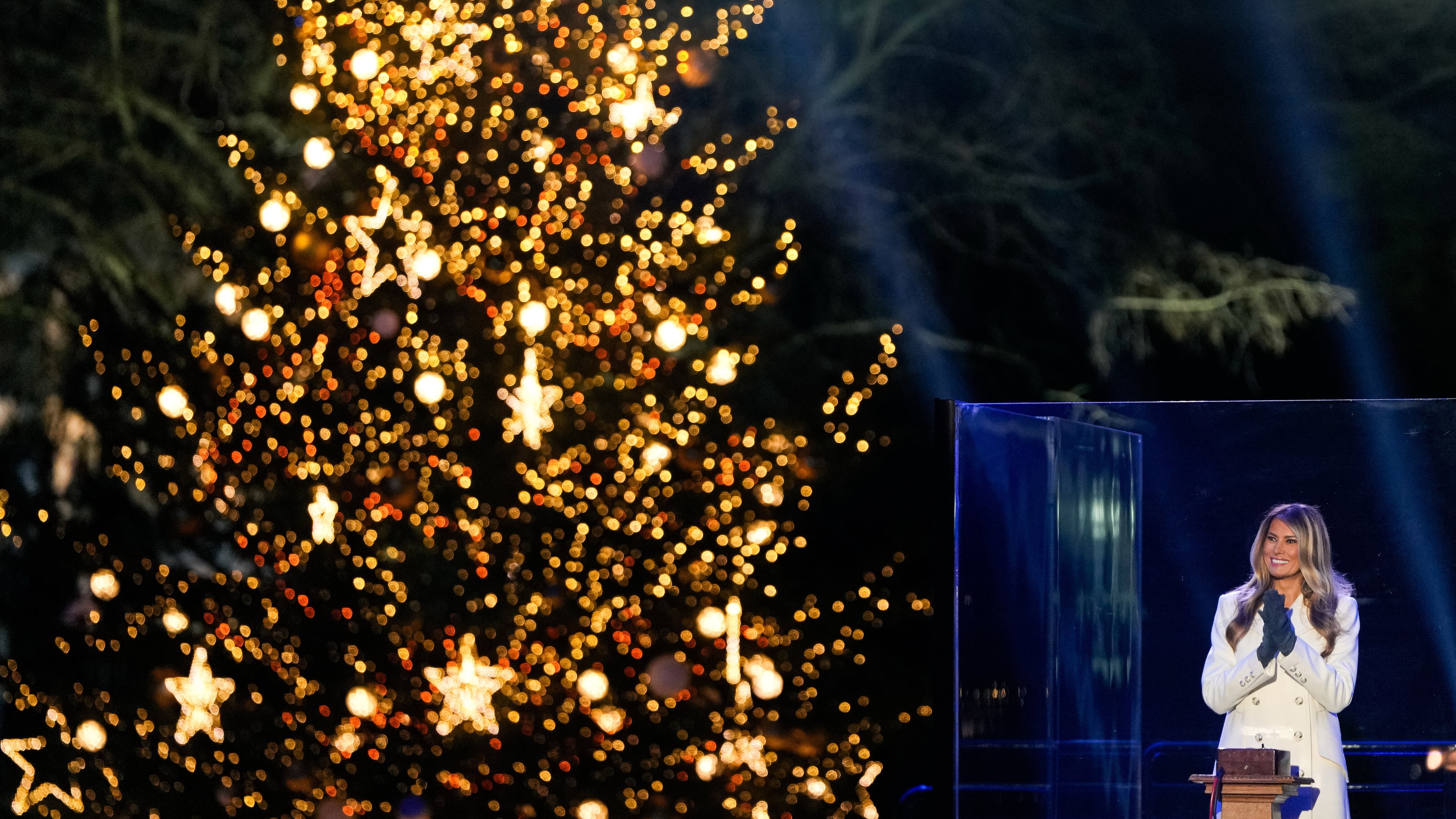 First lady Melania Trump claps after lighting the National Christmas Tree on the Ellipse, Thursday, Dec. 4, 2025, near the White House in Washington. (AP Photo/Julia Demaree Nikhinson)