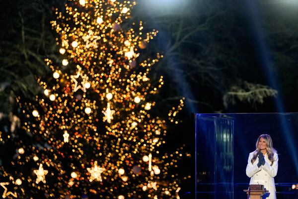 First lady Melania Trump clapped after lighting the National Christmas Tree near the White House on Thursday. (Julia Demaree Nikhinson/AP)
