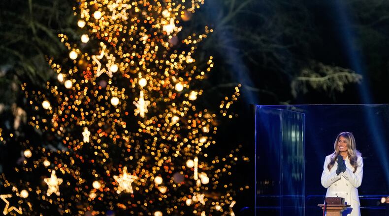 First lady Melania Trump claps after lighting the National Christmas Tree on the Ellipse, Thursday, Dec. 4, 2025, near the White House in Washington. (AP Photo/Julia Demaree Nikhinson)