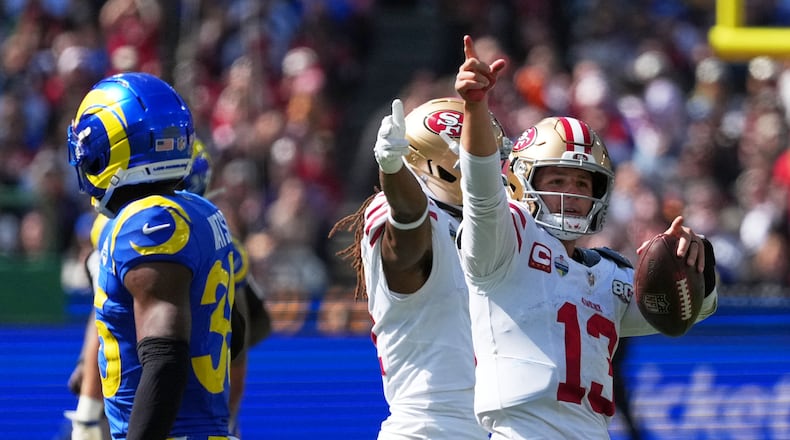 San Francisco 49ers quarterback Brock Purdy celebrates after a runs against the Los Angeles Rams during the second half of an NFL football game, Friday, Sept. 11, 2026, in Melbourne, Australia. (AP Photo/Asanka Brendon Ratnayake)