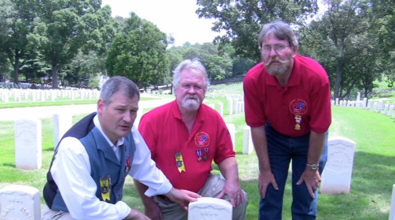 Brian Pierson of Sumter, S.C., Bill Miller of Marietta and Mark Hale of Jonesboro are active in the Sons of Union Veterans of the Civil War. They are pictured at the Marietta National Cemetery, where 10,312 Union dead are interred.