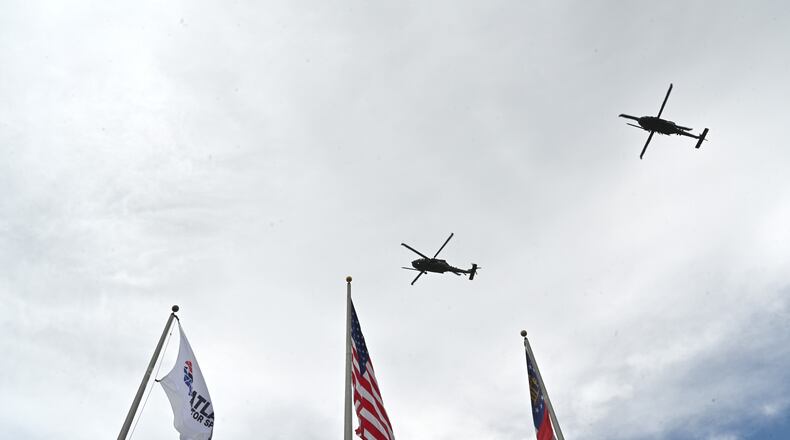 Two helicopters from Moody Air Force Base in Valdosta perform a fly-over before the start of the Quaker State 400 presented by Walmart Sunday, July 11, 2021, at Atlanta Motor Speedway in Hampton. (Hyosub Shin / Hyosub.Shin@ajc.com)