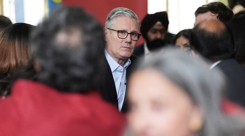 Britain's Prime Minister Sir Keir Starmer meets Labour Party members at Kingsdown Methodist Church Hall, in Ealing, west London, Friday May 8, 2026, a day after the local elections. (Stefan Rousseau/PA via AP)