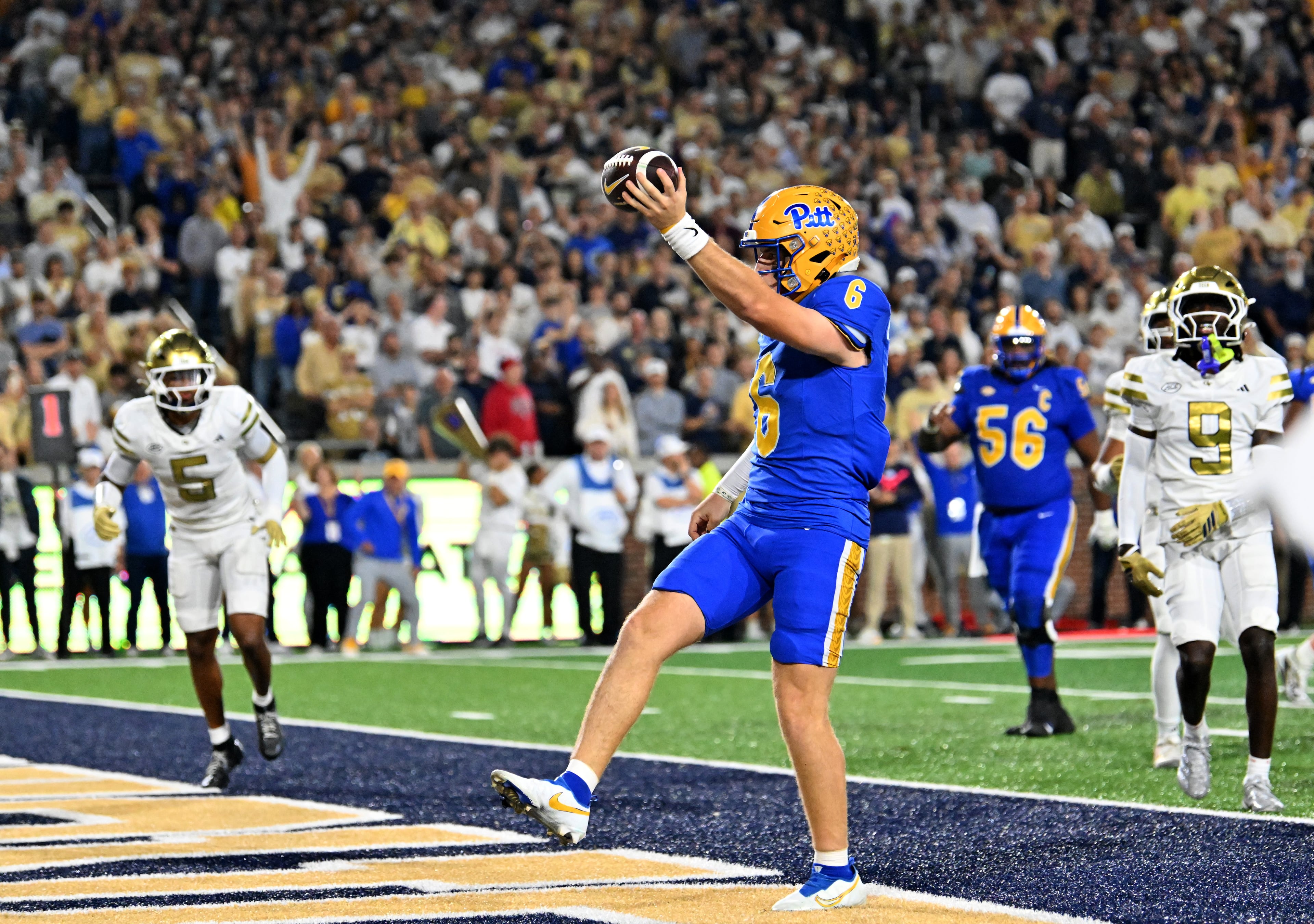 Pittsburgh quarterback Mason Heintschel (6) scores a touchdown during the first half in an NCAA college football game at Bobby Dodd Stadium, Saturday, November 22, 2025 in Atlanta. (Hyosub Shin / AJC)