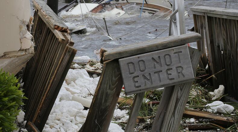 St. Marys: A dock comes to quick end and a destroyed cabin boat sits on the bottom after Hurricane Irma swept through the Town on Monday in St. Marys. Curtis Compton/ccompton@ajc.com