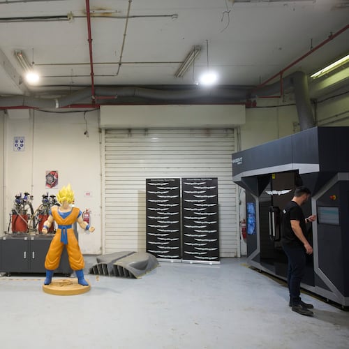 Workers operate a 3D printer that makes drone parts at the headquarters of Masssivit in Lod, Israel, March 30, 2026. (AP Photo/Ohad Zwigenberg)
