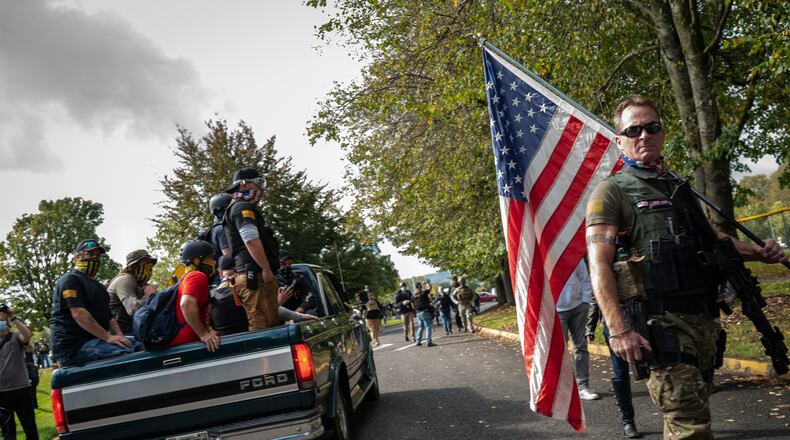 Participants gather for a Proud Boys rally in Portland, Oregon. 
Gay men reclaimed the label “proud” over the weekend, taking over the Twitter hashtag from the far-right Proud Boys who have been causing havoc and violence in the Pacific Northwest. (Diana Zeyneb Alhindawi/The New York Times)