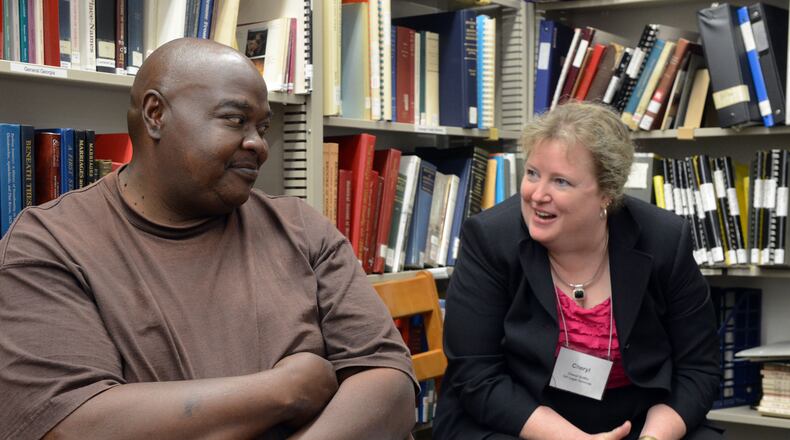 Cheryl Griffin talks with a former client, Lem Battle, during her office hours at the Clay County library. Griffin is a Legal Services attorney, riding the southwest Georgia circuit for clients who can't afford to pay for a lawyer's help.