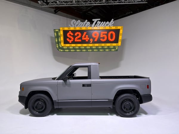 The Slate Truck is a rear-wheel-drive EV with a 205-mile range that can be transformed from a two-seat pickup into a five-seat SUV. Standard equipment, however, does not include a center armrest or a radio. (Credit: Eric Brandt/Cox Automotive)