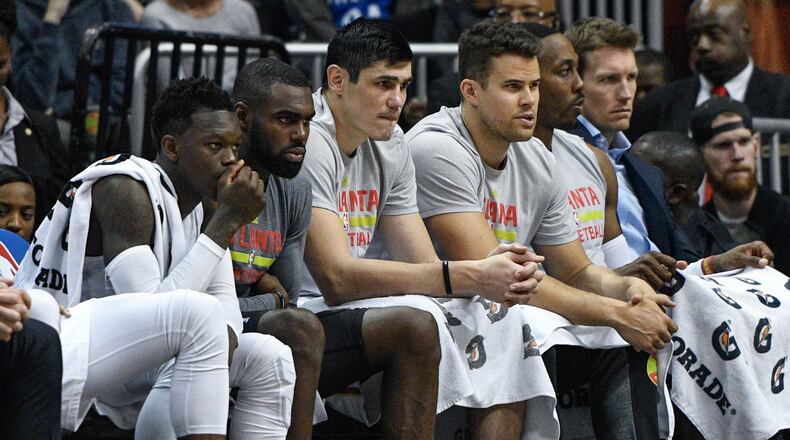 Atlanta Hawks players wait on the bench during the final moments of an NBA basketball game against the Portland Trail Blazers, Saturday, March 18, 2017, in Atlanta. Portland won 113-97. (AP Photo/John Amis)