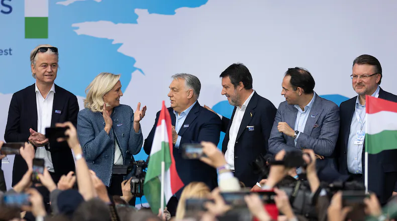Hungarian Prime Minister Viktor Orbán, third from left, stands with, from left; Geert Wilders of the Netherlands, France's Marine Le Pen, Italy's Matteo Salvini, Belgium's Tom Van Grieken and Latvia's Ainārs Šlesers during an assembly of European far-right parties with Orbán’s Patriots for Europe group, in Budapest, Hungary, Monday, March 23, 2026. (AP Photo/Denes Erdos)
