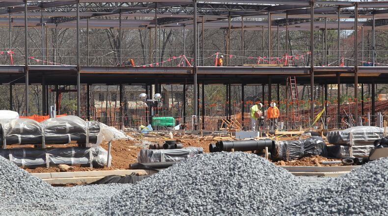 Construction workers work at the construction site of Brumby Elementary School in Marietta. The construction is being funded through money from a Special Purpose Local Option Sales Tax. Cobb County voters overwhelmingly approved an extension of the tax Tuesday. (HENRY TAYLOR / HENRY.TAYLOR@AJC.COM)