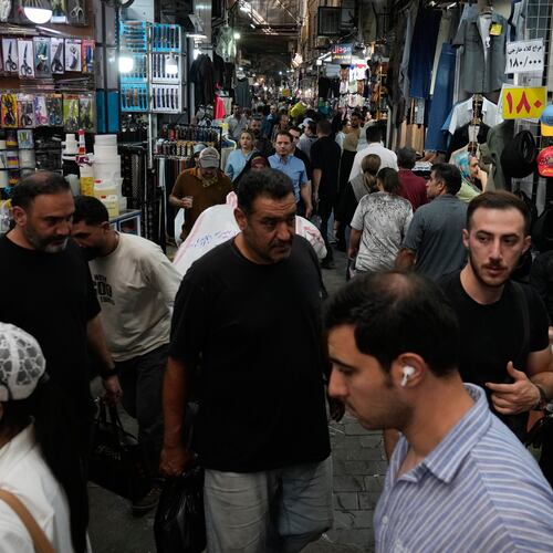 People walk in Tehran's traditional main bazaar, Iran, Saturday, Aug. 8, 2026. (AP Photo/Vahid Salemi)